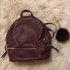 MK wine colored book bag w/ detachable Pom.